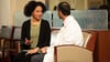 Reproductive endocrinologist Alberuni Zamah, MD, talking with a patient